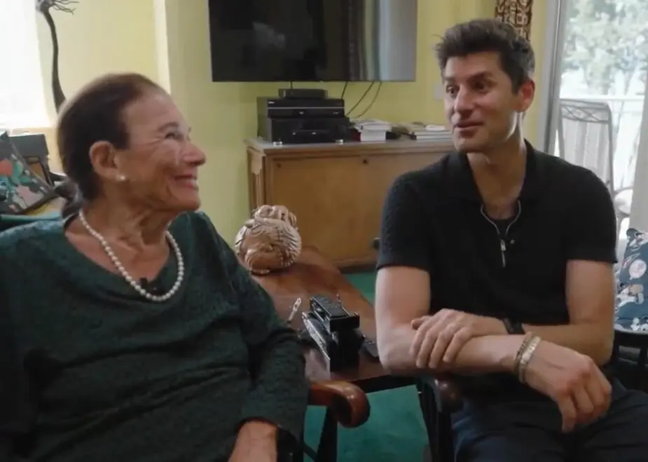 Muriel Fox with reporter